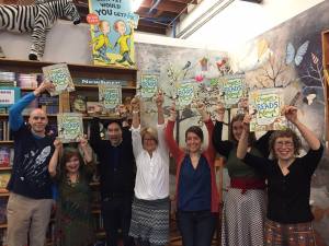 Holding up Oregon Reads Aloud book