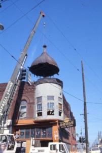 Crane removing the cupola on the Hill Block building
