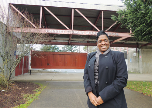 Principal Natasha Butler in front of the new Harriet Tubman Middle School