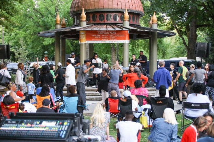 Dawson Park gazeebo with band and concert goers.